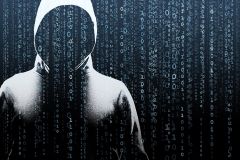 Anonymous computer hacker over abstract digital background. Obscured dark face in mask and hood. Data thief, internet attack, darknet fraud, dangerous viruses and cyber security.